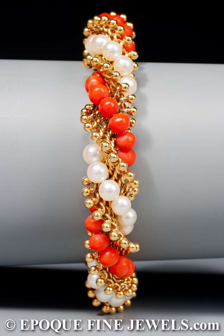 An 18 karat gold, pearl and coral torsade bracelet,